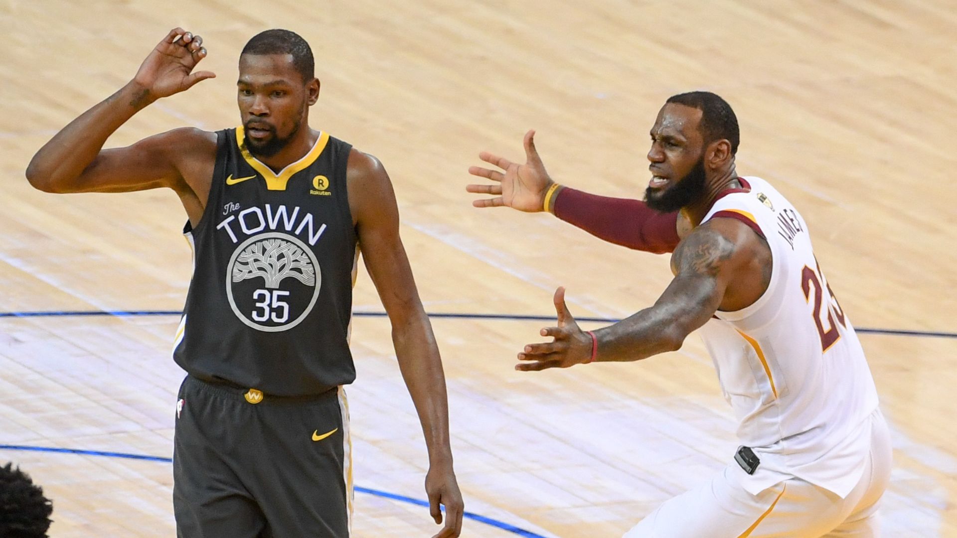 June 3, 2018; Oakland, CA, USA; Golden State Warriors forward Kevin Durant (35) and Cleveland Cavaliers forward LeBron James (23) react during the third quarter in game two of the 2018 NBA Finals at Oracle Arena.