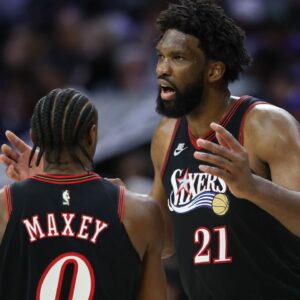 Philadelphia 76ers center Joel Embiid (21) talks with guard Tyrese Maxey during the second quarter against the Los Angeles Lakers at Xfinity Mobile Arena.