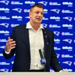 New England Patriots former player and current Fox Sports football analyst Rob Gronkowski speaks during a press conference where he signed a ceremonial one day contract at Gillette Stadium.