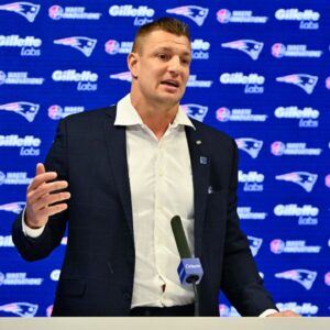 New England Patriots former player and current Fox Sports football analyst Rob Gronkowski speaks during a press conference where he signed a ceremonial one day contract at Gillette Stadium.