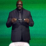 Dec 5, 2025; Washington, District of Columbia, USA; Shaquille O'Neal draws the card of Senegal for Group I during the FIFA World Cup 2026 Final Draw at John F. Kennedy Center for the Performing Arts