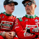 Former NASCAR Cup Series champion Kevin Harvick, center, right, and his son Keelan, 13, look on before the two raced in the 13th annual Masters of the Pros 200 race