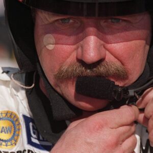 Dale Earnhardt, Sr. adjusts his helmet during testing at the Daytona International Speedway, January 5, 2001.