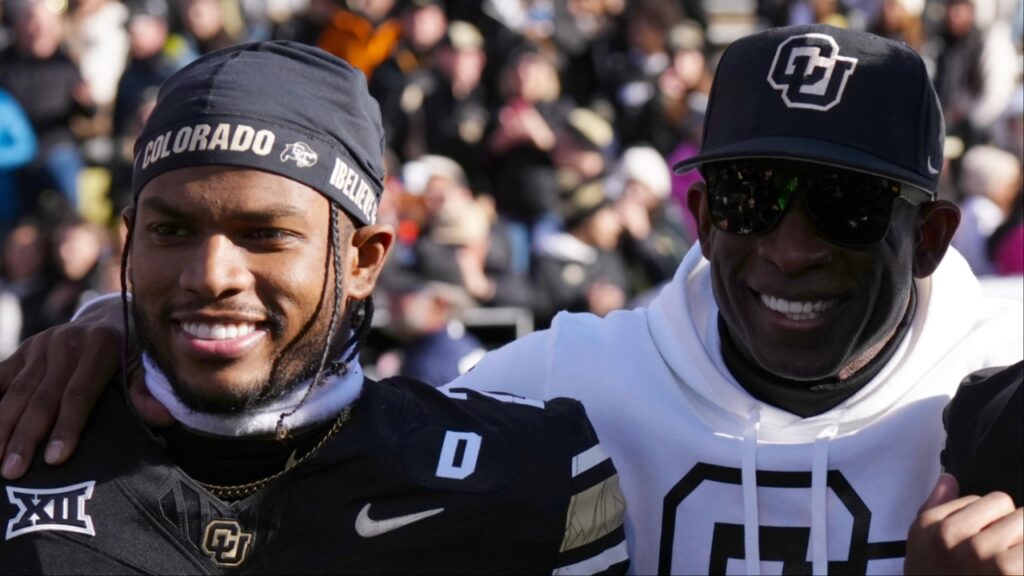 Colorado Buffaloes safety Shilo Sanders (21) and head coach Deion Sanders and quarterback Shedeur Sanders (2) and social media producer Deion Sanders Jr. following the win against the Oklahoma State Cowboys at Folsom Field.