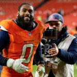 Denver Broncos linebacker Jonathon Cooper (0) runs off the field after the game against the Washington Commanders at Northwest Stadium.