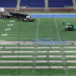 Work begins on the field at Ford Field in Detroit on Thursday, Jan. 26, 2023. The Lions are making the switch from a slit-film turf to a monofilament field turf, which is the most grass-like surface of the turf that is used in NFL stadiums. Fordfield 012623 Es02
