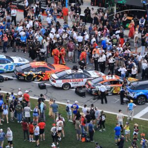 Feb 16, 2025; Daytona Beach, Florida, USA; NASCAR fans participate in pre race activities on pit row before the Daytona 500 at Daytona International Speedway.