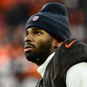 Cleveland Browns quarterback Shedeur Sanders (12) watches from the sidelines late in the fourth quarter against the Tennessee Titans at Huntington Bank Field.