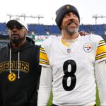 Pittsburgh Steelers head coach Mike Tomlin and quarterback Aaron Rodgers (8) walk off the field after the game against the Baltimore Ravens at M&T Bank Stadium.