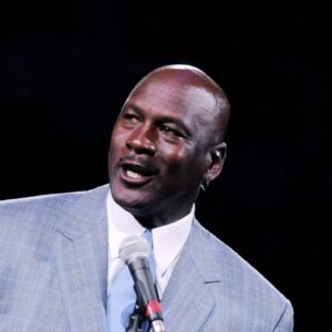 Dec 21, 2013; Charlotte, NC, USA; Charlotte Bobcats owner Michael Jordan unveils the new Charlotte Hornets logo at halftime during the game against the Utah Jazz at Time Warner Cable Arena