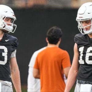 Texas quarterbacks Arch Manning (16) and Quinn Ewers talk during the team's first spring practice of 2023 at the Frank Denius Fields. 2023-03-06-manning-ewers