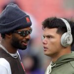 Browns quarterbacks Shedeur Sanders and Dillon Gabriel talk before a game, Nov. 16, 2025.