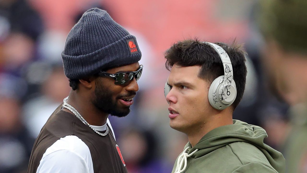 Browns quarterbacks Shedeur Sanders and Dillon Gabriel talk before a game, Nov. 16, 2025.