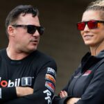 May 18, 2025; Joliet, IL, USA; NHRA top fuel driver Tony Stewart (left) with wife Leah Pruett during the Route 66 Nationals at Route 66 Raceway.