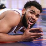 Jan 21, 2026; New York, New York, USA; New York Knicks center Karl-Anthony Towns (32) reacts after geting called for an offensive foul in the second quarter against the Brooklyn Nets at Madison Square Garden