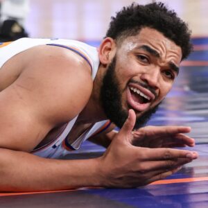 Jan 21, 2026; New York, New York, USA; New York Knicks center Karl-Anthony Towns (32) reacts after geting called for an offensive foul in the second quarter against the Brooklyn Nets at Madison Square Garden