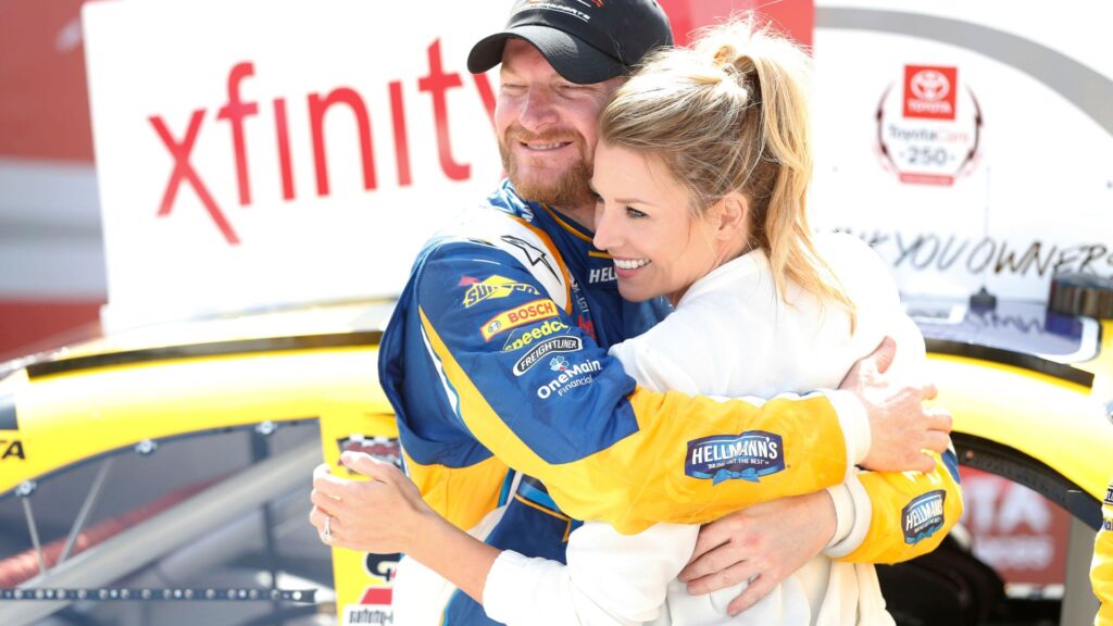 Apr 23, 2016; Richmond, VA, USA; Xfinity Series driver Dale Earnhardt Jr. (88) celebrates with his fianc Amy Reimann in Victory Lane after winning the Toyotacare 250 at Richmond International Raceway.