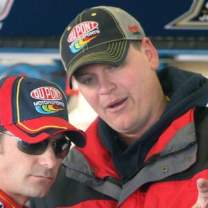 Jeff Gordon (left) and his crew chief Steve Letarte talk in the garage during Nextel Cup series practice at Daytona International Speedway in Daytona Beach, Florida, Friday, February 16, 2007