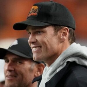 Jan 19, 2026; Miami Gardens, FL, USA; Tom Brady looks on from the sideline before the CFP National Championship college football game between the Indiana Hoosiers and the Miami Hurricanes at Hard Rock Stadium. Mandatory Credit: Kirby Lee-Imagn Images