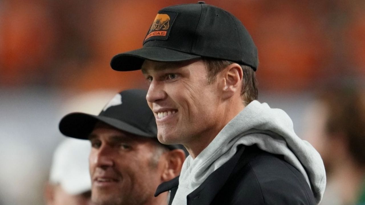 Jan 19, 2026; Miami Gardens, FL, USA; Tom Brady looks on from the sideline before the CFP National Championship college football game between the Indiana Hoosiers and the Miami Hurricanes at Hard Rock Stadium. Mandatory Credit: Kirby Lee-Imagn Images