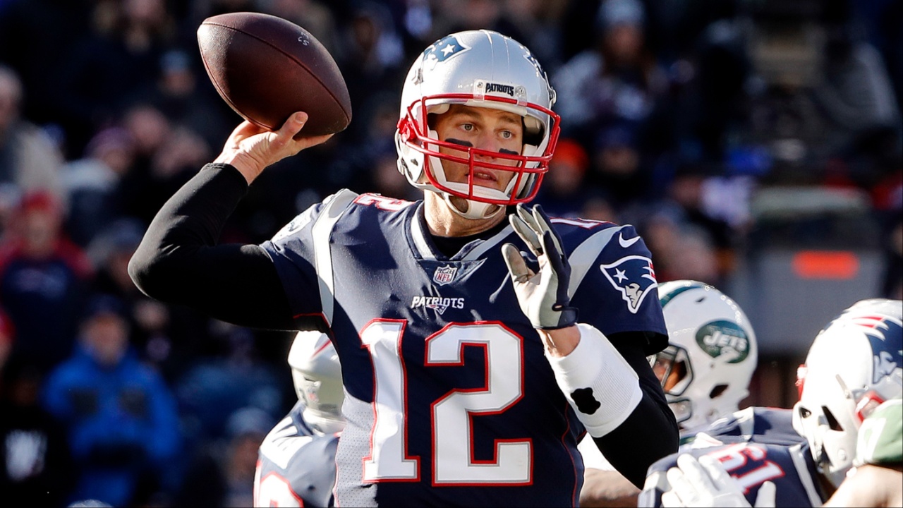 New England Patriots quarterback Tom Brady (12) throws against the New York Jets during the first half at Gillette Stadium.