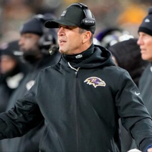 Baltimore Ravens head coach John Harbaugh reacts to a play during the first quarter against the Green Bay Packers at Lambeau Field.