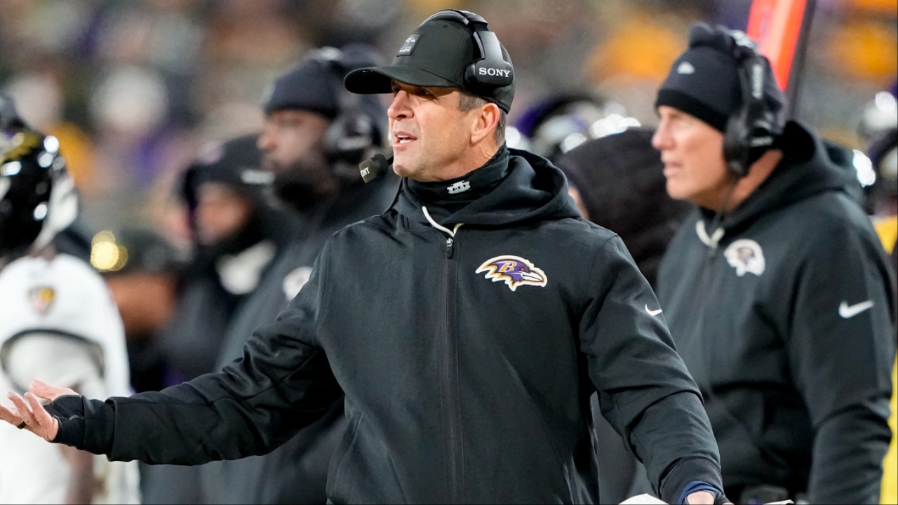 Baltimore Ravens head coach John Harbaugh reacts to a play during the first quarter against the Green Bay Packers at Lambeau Field.