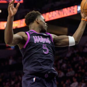 Jan 25, 2026; Minneapolis, Minnesota, USA; Minnesota Timberwolves guard Anthony Edwards (5) secures a rebound in the fourth quarter against the Golden State Warriors at Target Center.