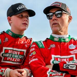 Former NASCAR Cup Series champion Kevin Harvick, center, right, and his son Keelan, 13, look on before the two raced in the 13th annual Masters of the Pros 200 race on Wednesday, July 16, 2025, at the Owosso Speedway.