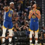 Oct 27, 2025; San Francisco, California, USA; Golden State Warriors forward Jimmy Butler III (10) talks with guard Stephen Curry (30) during a break in the action against the Memphis Grizzlies in the third quarter at the Chase Center