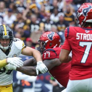 Houston Texans offensive tackle George Fant (77) attempts to block Pittsburgh Steelers linebacker T.J. Watt (90) as Texans quarterback C.J. Stroud (7) looks for an open receiver during the third quarter at NRG Stadium.