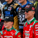 Former NASCAR Cup Series champion Kevin Harvick, center, and his 13-year-old son Keelan, left, pose with other drivers before the 13th annual Masters of the Pros 200 race on Wednesday, July 16, 2025, at the Owosso Speedway.