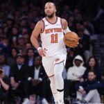 New York Knicks guard Jalen Brunson (11) dribbles up court against the LA Clippers during the second half at Madison Square Garden