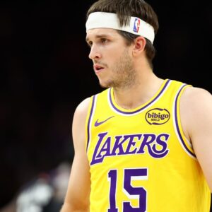 Dec 23, 2025; Phoenix, Arizona, USA; Los Angeles Lakers guard Austin Reaves (15) against the Phoenix Suns at Mortgage Matchup Center