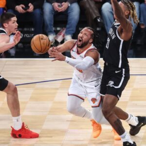 New York Knicks guard Jalen Brunson (11) looks to drive past Brooklyn Nets forward Noah Clowney (21) and guard Egor Demin (8) in the first quarter at Madison Square Garden