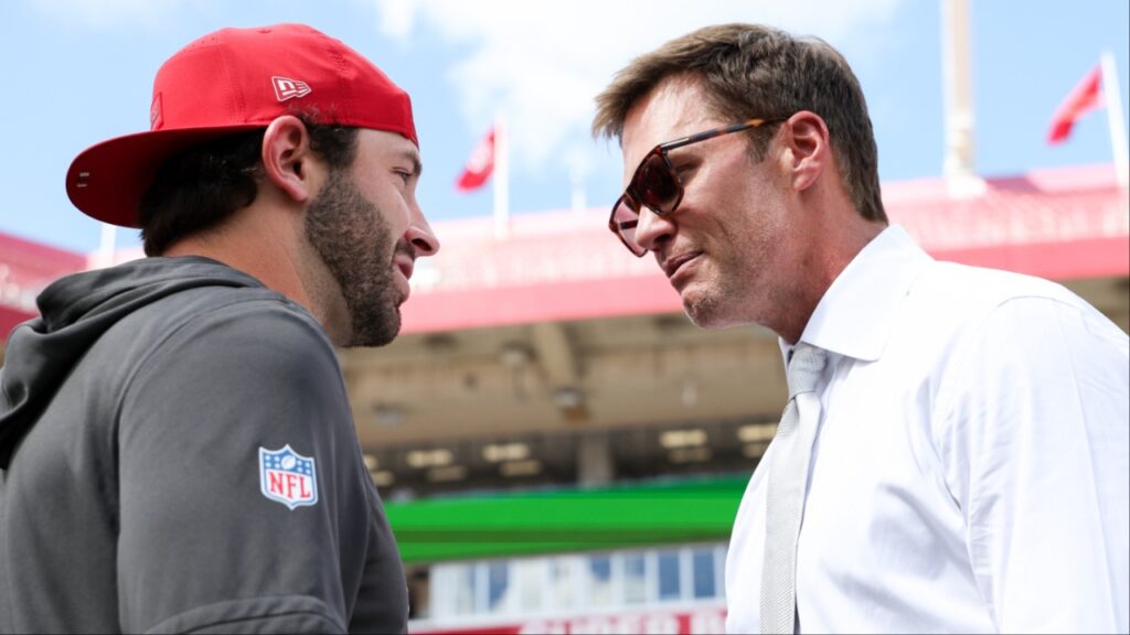 Tampa Bay Buccaneers quarterback Baker Mayfield (6), left, speaks with Tom Brady before the game against the Philadelphia Eagles at Raymond James Stadium.