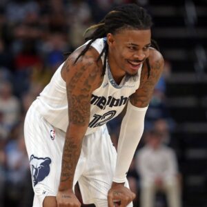 Dec 26, 2025; Memphis, Tennessee, USA; Memphis Grizzlies guard Ja Morant (12) reacts during the second quarter against the Milwaukee Bucks at FedExForum