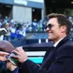 Tom Brady signs autographs before the 2026 NFC Championship Game between the Seattle Seahawks and the Los Angeles Rams at Lumen Field.