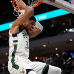Milwaukee Bucks forward Giannis Antetokounmpo (34) reacts following a dunk during the first quarter against the Washington Wizards at Fiserv Forum