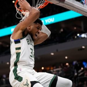 Milwaukee Bucks forward Giannis Antetokounmpo (34) reacts following a dunk during the first quarter against the Washington Wizards at Fiserv Forum