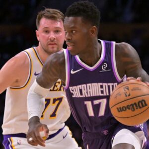 Sacramento Kings guard Dennis Schroder (17) drives past Los Angeles Lakers guard Luka Doncic (77) in the first half at Crypto.com Arena.