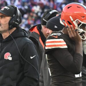 Cleveland Browns head coach Kevin Stefanski and quarterback Shedeur Sanders (12) on the sidelines against the Buffalo Bills during the second half at Huntington Bank Field.