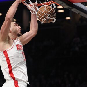 Jan 1, 2026; Brooklyn, New York, USA; Houston Rockets center Alperen Sengun (28) dunks the ball during the second half against the Brooklyn Nets at Barclays Center