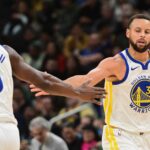 Oct 30, 2025; Milwaukee, Wisconsin, USA; Golden State Warriors guard Stephen Curry (30) reacts with forward Jimmy Butler (10) after scoring a basket in the 3rd quarter against the Milwaukee Bucks