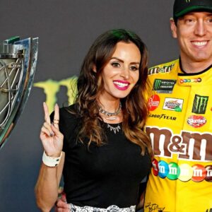 Nov 17, 2019; Homestead, FL, USA; NASCAR Cup Series driver Kyle Busch (18) celebrates after winning the NASCAR Series Cup Championship with his wife Samantha Busch after the Ford EcoBoost 400 at Homestead-Miami Speedway.