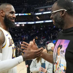 Jan 25, 2025; San Francisco, California, USA; Los Angeles Lakers forward LeBron James (left) talks with Golden State Warriors forward Draymond Green (right) after the game at Chase Center.