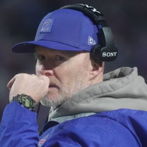 Buffalo Bills head coach Sean McDermott talks to one of the assistant coaches during second half action against the Philadelphia Eagles at Highmark Stadium in Orchard Park on Dec. 28, 2025.