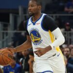 Jan 20, 2026; San Francisco, California, USA; Golden State Warriors forward Jonathan Kuminga (1) looks to pass against the Toronto Raptors in the second quarter at Chase Center.