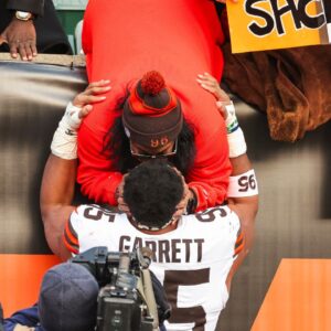Cleveland Browns defensive end Myles Garrett (95) greets family following a victory against the Cincinnati Bengals at Paycor Stadium.