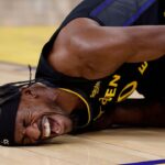 Golden State Warriors forward Jimmy Butler III (10)he goes down with a knee injury during the third quarter against the Miami Heat at Chase Center.